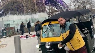 توك توك مصري أمام برج إيفل يثير ضجة.. وصاحب الصورة يوضح