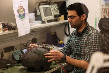 A worker at the Israeli startup Brain.Space builds an electroencephalogram (EEG) enabled helmet, due to be used in an experiment on the impact of a microgravity environment on the brain activity of astronauts, in Tel Aviv, Israel. (Reuters)
