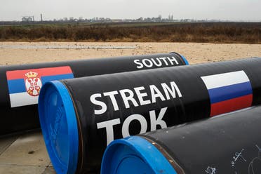 Gas pipes bearing the flags of Serbia and Russia (R) lie on the ground near the Serbian village of Sajkas, where Serbia ceremonially launched its leg of Russia's South Stream pipeline before the project was cancelled, December 10, 2014. (Reuters)