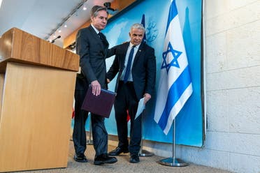 US Secretary of State Antony Blinken and Israel's Foreign Minister Yair Lapid leave after a news conference at Israel's Ministry of Foreign Affairs in Jerusalem, March 27, 2022. (Reuters)