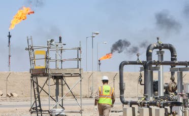 A worker walks at the Majnoon oil field, near Basra, Iraq, on March 27, 2022. (Reuters)
