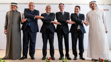 Bahrain’s Foreign Minister Abdullatif bin Rashid al-Zayani, Egypt’s Foreign Minister Sameh Shoukry, Israel’s Foreign Minister Yair Lapid, US Secretary of State Antony Blinken, Morocco’s Foreign Minister Nasser Bourita and UAE Foreign Minister Sheikh Abdullah bin Zayed Al Nahyan get ready to pose for a photograph during the Negev Summit in Sde Boker, Israel, on March 28, 2022. (Reuters)