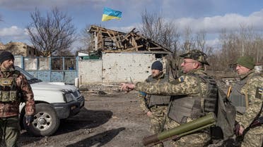 FILE PHOTO: FILE PHOTO: Ukranian servicemen stand in the village of Lukyanivka outside Kyiv, as Russia's invasion of Ukraine continues, Ukraine, March 27, 2022. REUTERS/Marko Djurica/File Photo/File Photo