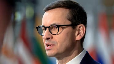 Poland's Prime Minister Mateusz Morawiecki speaks to the media as he arrives for European Union leaders' summit, amid Russia's invasion of Ukraine, in Brussels, Belgium, March 25, 2022. (Reuters)