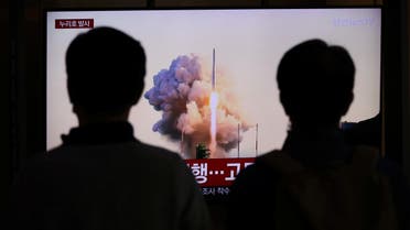 People watch a TV broadcasting a news report on the KSLV-II NURI rocket launching from its launch pad of the Naro Space Center, at a railway station in Seoul, South Korea, October 21, 2021. (File photo: Reuters)