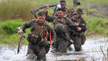 U.S. military forces cross a flooded area near the shore during the annual Philippines-US amphibious landing exercise (PHIBLEX) at San Antonio, Zambales province, Philippines October 7, 2016. (File photo: Reuters)