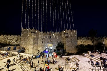 A general view shows the Damascus Gate decorated with lights ahead of the holy month of Ramadan in Jerusalem's Old City, March 29, 2022. Picture taken March 29, 2022. (Reuters)