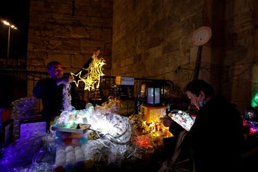 A vendor sells decorations ahead of the holy month of Ramadan in Jerusalem's Old City, March 29, 2022. (Reuters)