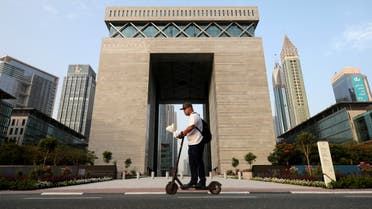 A man rides an electirc scooter past The Gate building at Dubai International Financial Centre (DIFC) in Dubai, United Arab Emirates June 23, 2019. (File photo: Reuters)