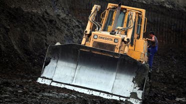 A coal miner climbs into a front-end loader at the coal mine in Lazarevac September 14, 2010. (File photo: Reuters)