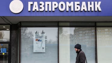 A man walks past a branch office of Gazprombank in Moscow, Russia March 31, 2022. (Reuters)