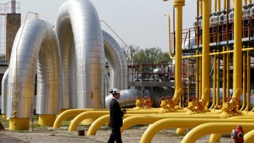 A security worker walks past pipelines at a gas compressor station on Slovakia-Ukraine border in Velke Kapusany September 2, 2014. Ukraine had begun test imports of gas from Slovakia in August via an upgraded pipeline, as the country tries to secure greater energy independence from Russia. (Reuters))