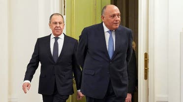 Russian Foreign Minister Sergei Lavrov (L) and Egypt's Foreign Minister Sameh Shoukry walk prior to talks of representatives of the Arab League states with Sergei Lavrov in Moscow on April 4, 2022. (AFP)