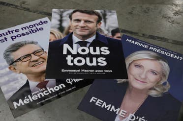 Campaign posters of French President Emmanuel Macron, Marine Le Pen and Jean-Luc Mélenchon are displayed at France Affichage Plus dispatch hub in Mitry-Mory, outside Paris, on March 22. (Reuters)