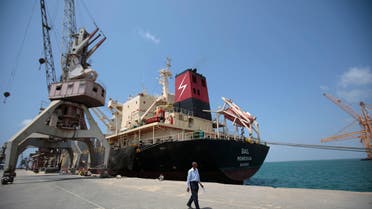 FILE - In this Sept. 29, 2018 file photo, a cargo ship is docked at the port, in Hodeida, Yemen. U.N. Special Envoy for Yemen Martin Griffiths released a statement Thursday, Oct. 8, 2020 condemning the recent clashes in Yemen’s strategic port city of Hodeida, which has so far left dozens of casualties, and urged the country’s warring parties to immediately stop the fighting. Since Saturday, clashes have flared up between Yemen’s Houthi rebels and government forces south of the port in Hodeida, which handles about 70% of Yemen’s commercial and humanitarian imports. (AP Photo/Hani Mohammed, File)