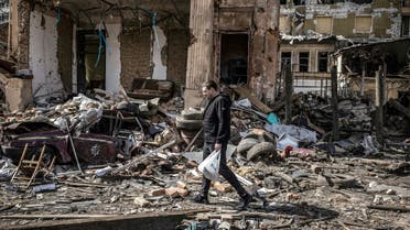 A man walks in the rubble of a destroyed building in the eastern Ukraine city of Kharkiv on april 2, 2022, as Ukraine said today Russian forces were making a rapid retreat from northern areas around the capital Kyiv and the city of Chernigiv.  (AFP)