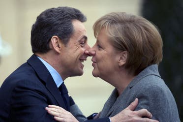  المستشارة الألمانية السابقة أنجيلا ميركل والرئيس الفرنسي السابق نيكولا ساركوزي(أرشيفية- فرانس برس)