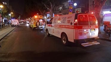 First responders arrive at the scene of a shooting attack at a cafe in Disengoff Street in the centre of Israel's Mediterranean coastal city of Tel Aviv on April 7, 2022. (AFP)