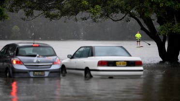 Flooding from a swollen Manly Creek is seen inundating cars and the street at Campbell Parade, in Manly Vale, north of Sydney, Australia, March 8, 2022. (File photo: Reuters)