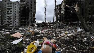 his photograph taken on April 6, 2022 shows a toy and personal belongings amongst rumbles in front of a destroyed residential building, in the town of Borodianka, northwest of Kyiv. (AFP)