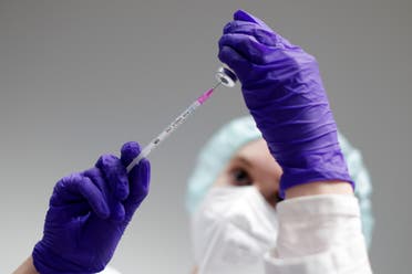 A file photo shows a nurse prepares a shot of Pfizer-BioNTech coronavirus disease (COVID-19) vaccine at the vaccination center in the Humboldt Forum in Berlin, Germany January 19, 2022. (Reuters)