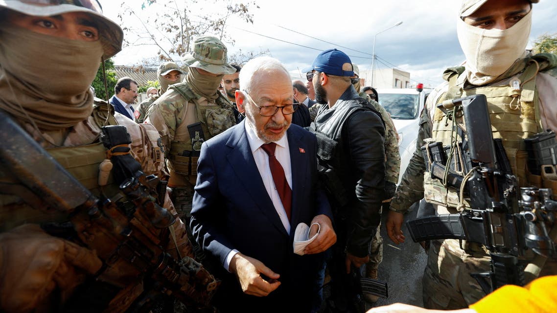 Tunisia’s Rachid Ghannouchi, head of Ennahda party and speaker of the parliament, is surrounded by presidential guard members upon his arrival for questioning after he was summoned by Tunisian anti-terrorism police in Tunis, Tunisia April 1, 2022. (Reuters)