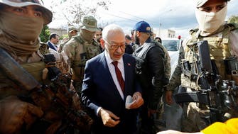Tunisian court bans travel for Ennahda party chief, 33 others