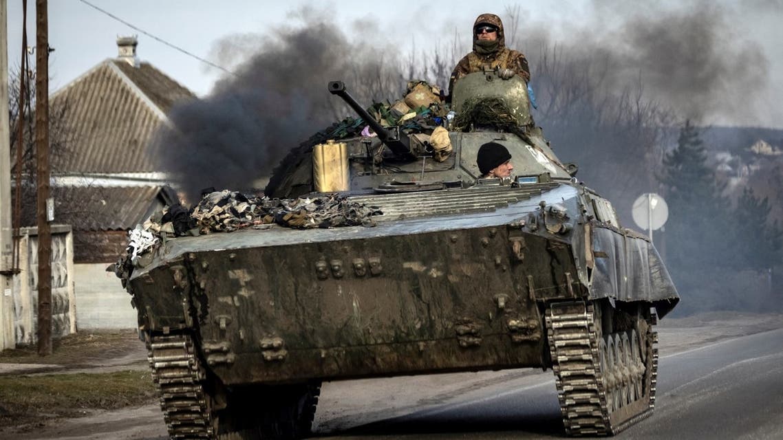 A Ukrainian tank steers his way on a road in the northeastern city of Trostyanets, on March 29, 2022. (AFP)