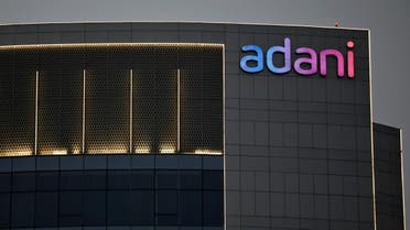 The logo of the Adani Group is seen on the facade of one of its buildings on the outskirts of Ahmedabad, India, April 13, 2021. (Reuters)