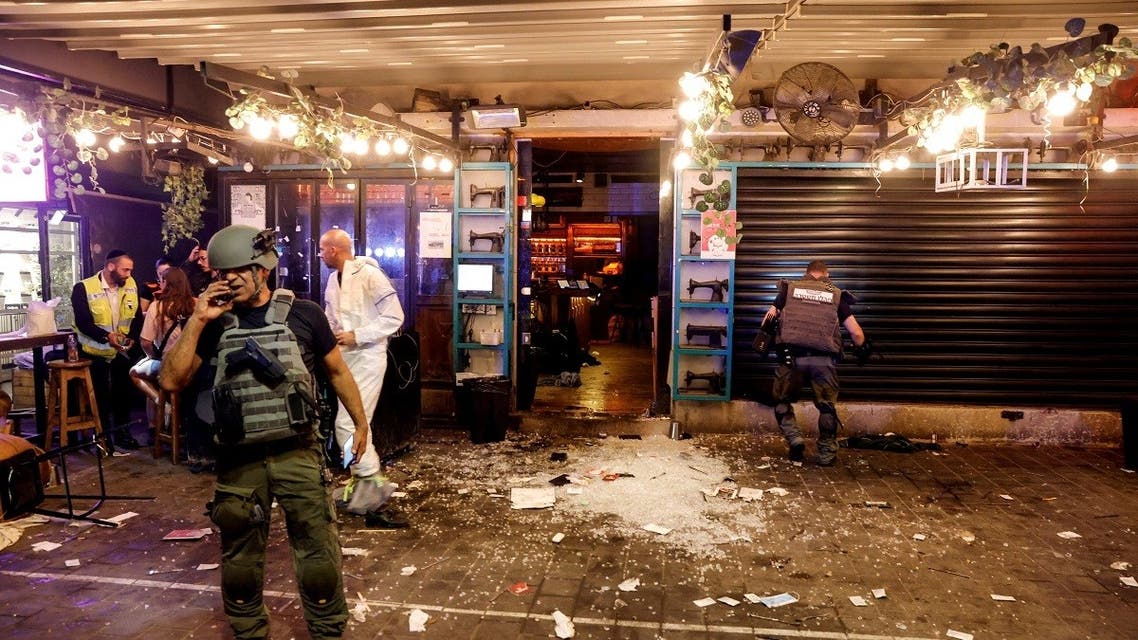 Israeli security and rescue personnel work by the entrance to a restaurant following an incident in Tel Aviv, Israel on April 7, 2022. (Reuters)