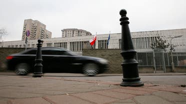 A car drives past a building of the Polish embassy in Moscow, November 17, 2014. Russia said on Monday several of its diplomats had been expelled from Poland and that a number of Polish diplomats had left Russia after Moscow took adequate measures in return. REUTERS/Maxim Shemetov (RUSSIA - Tags: POLITICS)