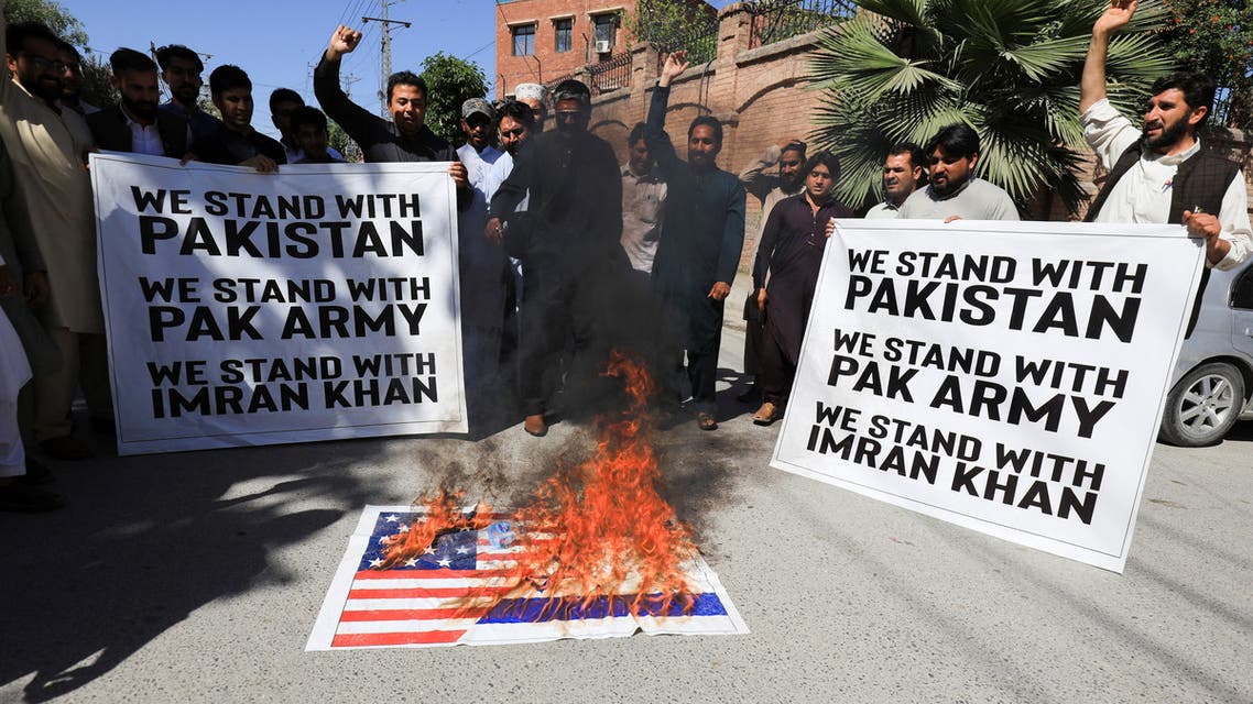 Supporters of the Pakistan Tehreek-e-Insaf (PTI) political party, burn the U.S. flag, accusing the U.S. of plotting to overthrow Pakistani Prime Minister Imran Khan, during a protest in Peshawar, Pakistan, April 1, 2022. (Reuters)