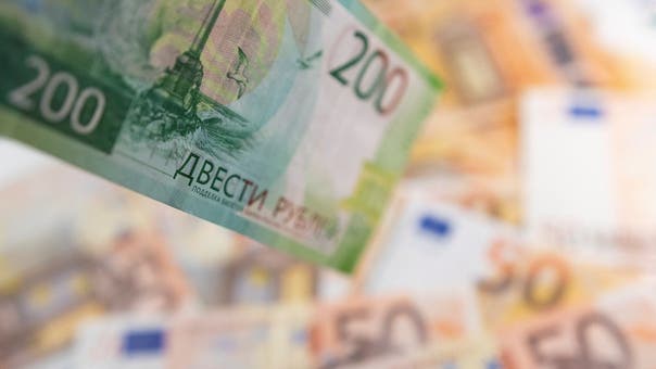 Russian ruble firms to early 2020 levels near 65 vs dollar