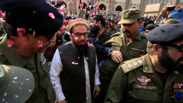 Hafiz Saeed is showered with flower petals as he walks to court before a Pakistani court ordered his release from house arrest in Lahore, Pakistan November 22, 2017. (File photo: Reuters)