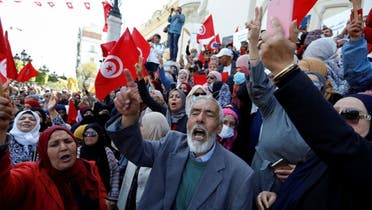 Demonstrators shout slogans during a protest against Tunisian President Kais Saied after he dissolved the parliament last month, in Tunis, Tunisia, on April 10, 2022. (Reuters)