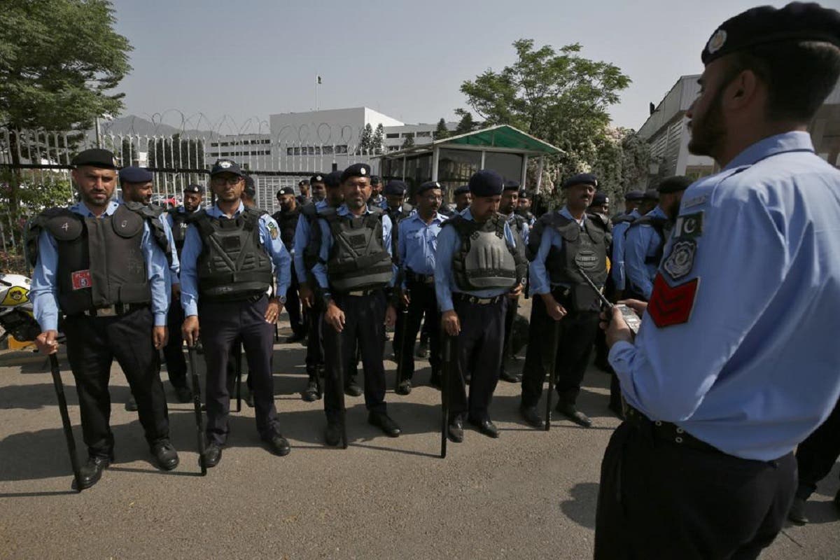 Police officers stand guard to ensure security outside the National Assembly in Islamabad, Pakistan, Saturday, April 9, 2022. (AP)