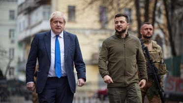 A handout photo released by the Ukrainian Presidential Press Service shows British Prime Minister Boris Johnson (L) and Ukrainian President Volodymyr Zelensky (R) walking in central Kyiv, on April 9, 2022. (AFP)