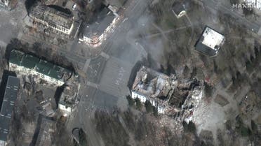 This handout file satellite image distributed by Maxar Technologies on March 29, 2022 shows a close up of the extensive damage to the Mariupol theater and nearby buildings in Mariupol. (AFP)