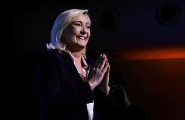 Marine Le Pen, leader of French far-right National Rally (Rassemblement National) party and candidate for the 2022 French presidential election, gestures as she appears on stage after partial results in the first round of the 2022 French presidential election are announced, in Paris, in Paris, France, on April 10, 2022. (Reuters)