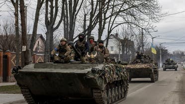 Ukrainian soldiers are seen on tanks, amid Russia's invasion of Ukraine, in Bucha, Kyiv region, Ukraine, April 6, 2022. REUTERS/Alkis Konstantinidis