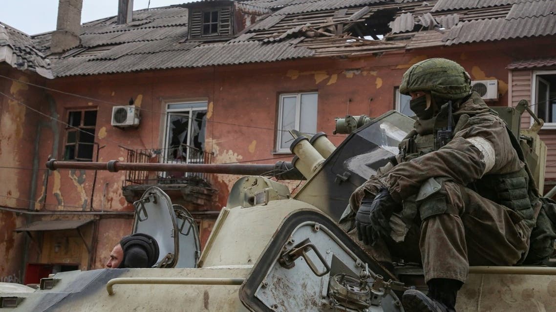 Pro-Russian troops drive an armored vehicle in Mariupol, Ukraine April 11, 2022. (Reuters)