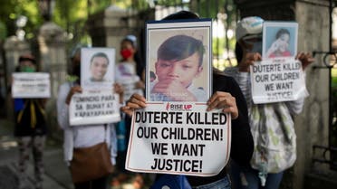 Relatives of drug war victims hold photographs of their slain loved ones with placards calling for justice, during a protest to commemorate President Rodrigo Duterte's final year in office, in Manila, Philippines, June 30, 2021. (File photo: Reuters)