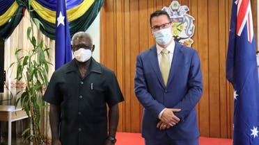 Solomon Islands Prime Minister Manasseh Sogavare and Australian Minister for International Development and the Pacific, Zed Seselja, pose for a picture as they attend a meeting to discuss China security pact in Honiara, Solomon Islands, April 13, 2022. (Reuters)