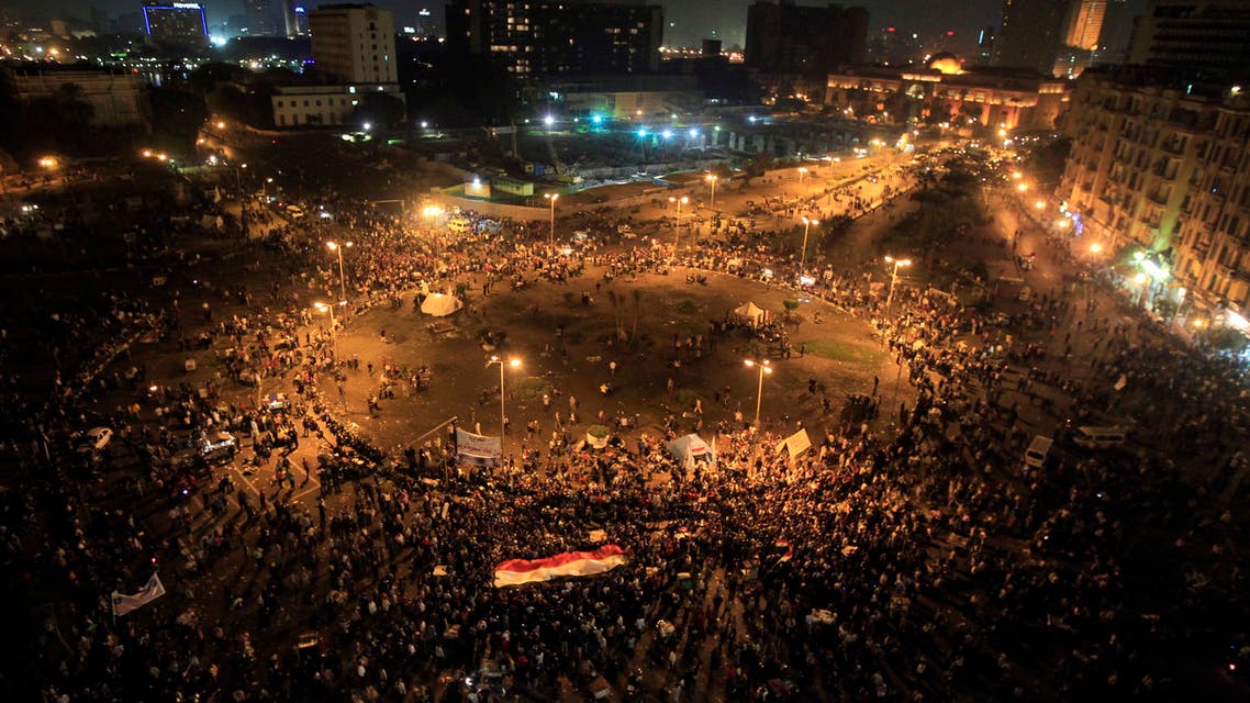 Protesters gather at Tahrir square in Cairo November 23, 2012. Angry youths hurled rocks at security forces and burned a police truck as thousands gathered in central Cairo to protest at Egyptian President Mohamed Mursi's decision to grab sweeping new powers. Police fired tear gas near Tahrir Square, heart of the 2011 uprising that toppled Hosni Mubarak at the height of the Arab Spring. Thousands demanded that Mursi should quit and accused him of launching a coup. REUTERS/Mohamed Abd El Ghany (EGYPT - Tags: POLITICS CIVIL UNREST)