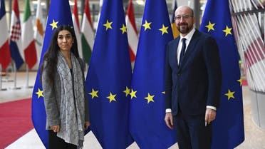 President of the European Council Charles Michel (R) and Yazidi activist Nadia Murad (L), co-recipient of the 2018 Nobel Peace Prize, pose at the Europa building prior to their bilateral meeting in Brussels on December 20, 2021. (AFP)