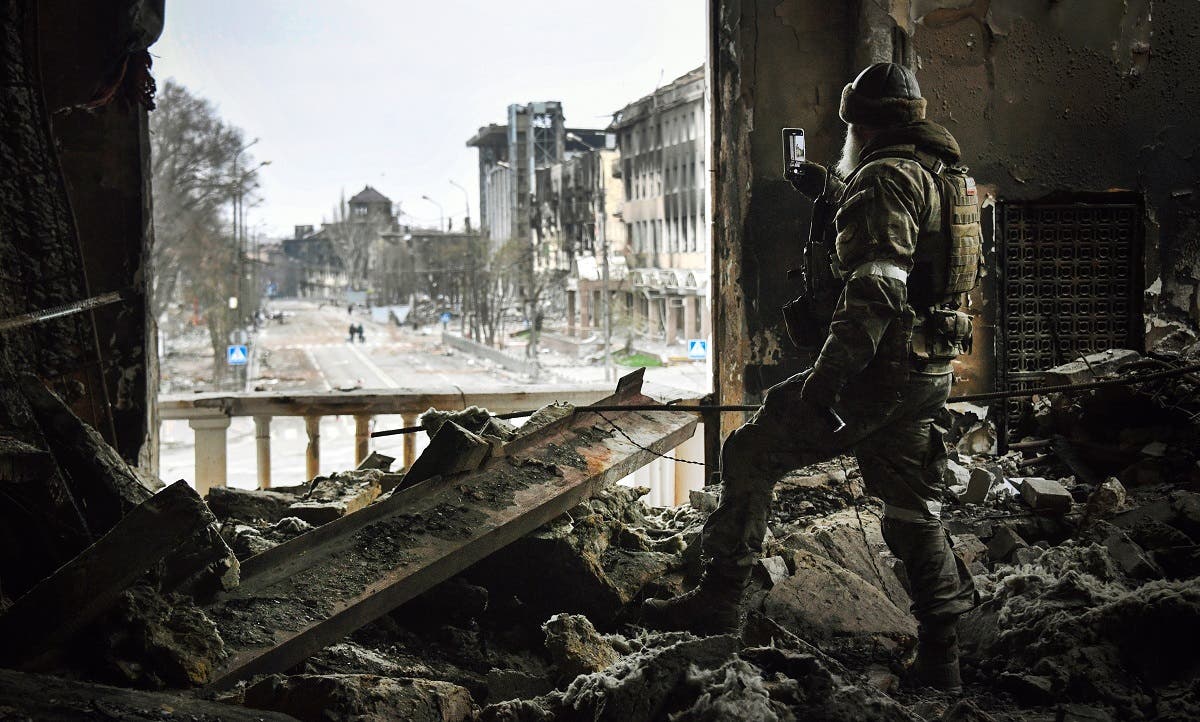 A Russian soldier patrols at the Mariupol drama theatre, bombed last March 16, on April 12, 2022 in Mariupol. (AFP)