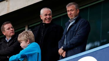 Chelsea’s Russian owner Roman Abramovich (R) stands with Eugene Tenenbaum as they arrive to watch the English Premier League football match between Chelsea and Manchester United at Stamford Bridge in London on January 19, 2014. (AFP)