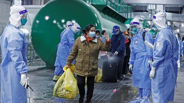 Discharged patients leave the National Exhibition and Convention Center, which has been converted into a makeshift hospital for the coronavirus disease (COVID-19), in Shanghai, China April 14, 2022. (Reuters)