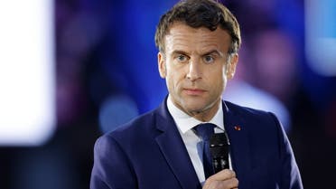 French President Emmanuel Macron, candidate for re-election in the 2022 French presidential election, delivers a speech during a campaign meeting at the Place du Chateau near the Cathedral in Strasbourg, France April 12, 2022. (Reuters)
