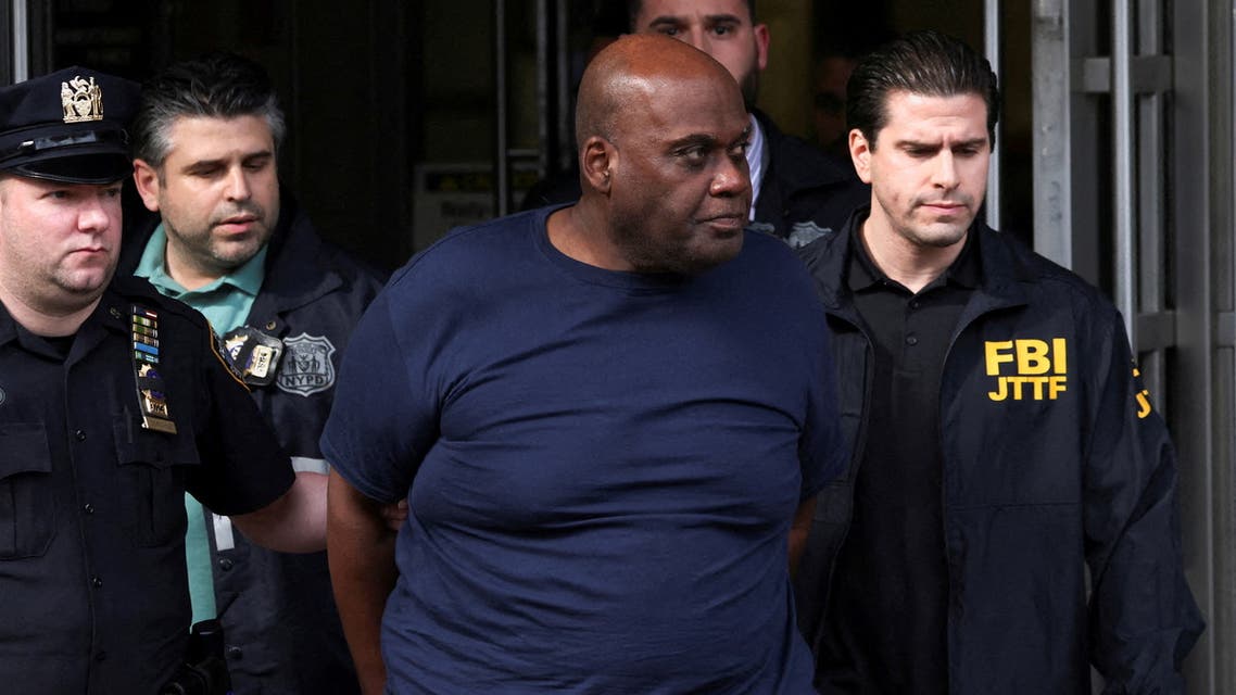 Frank James, the suspect in the Brooklyn subway shooting walks outside a police precinct in New York City, New York, U.S., April 13, 2022. REUTERS/Andrew Kelly TPX IMAGES OF THE DAY